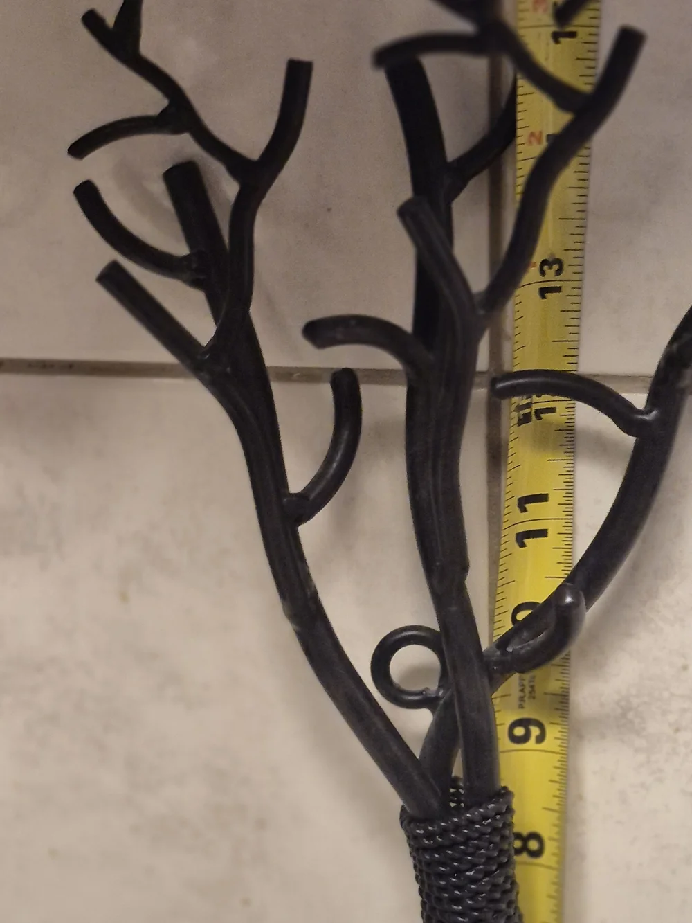 Wall-Mounted Brown Metal Branch Sconce with Cream Candle Holder. Its 17